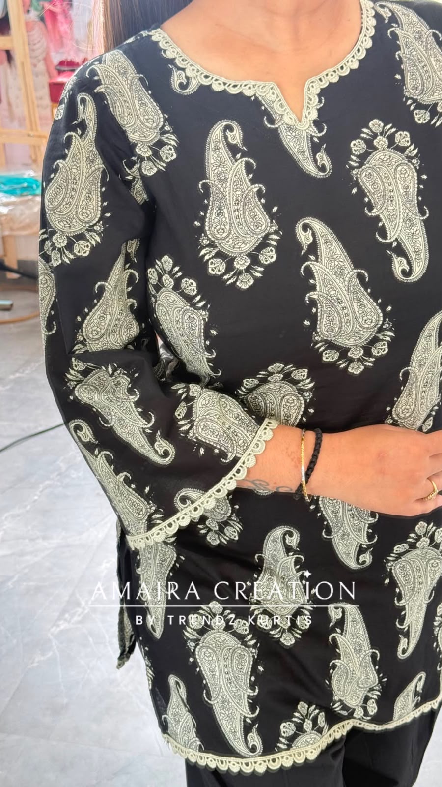 Paisley Printed Black Cotton Short Kurti with Back Knot Dori